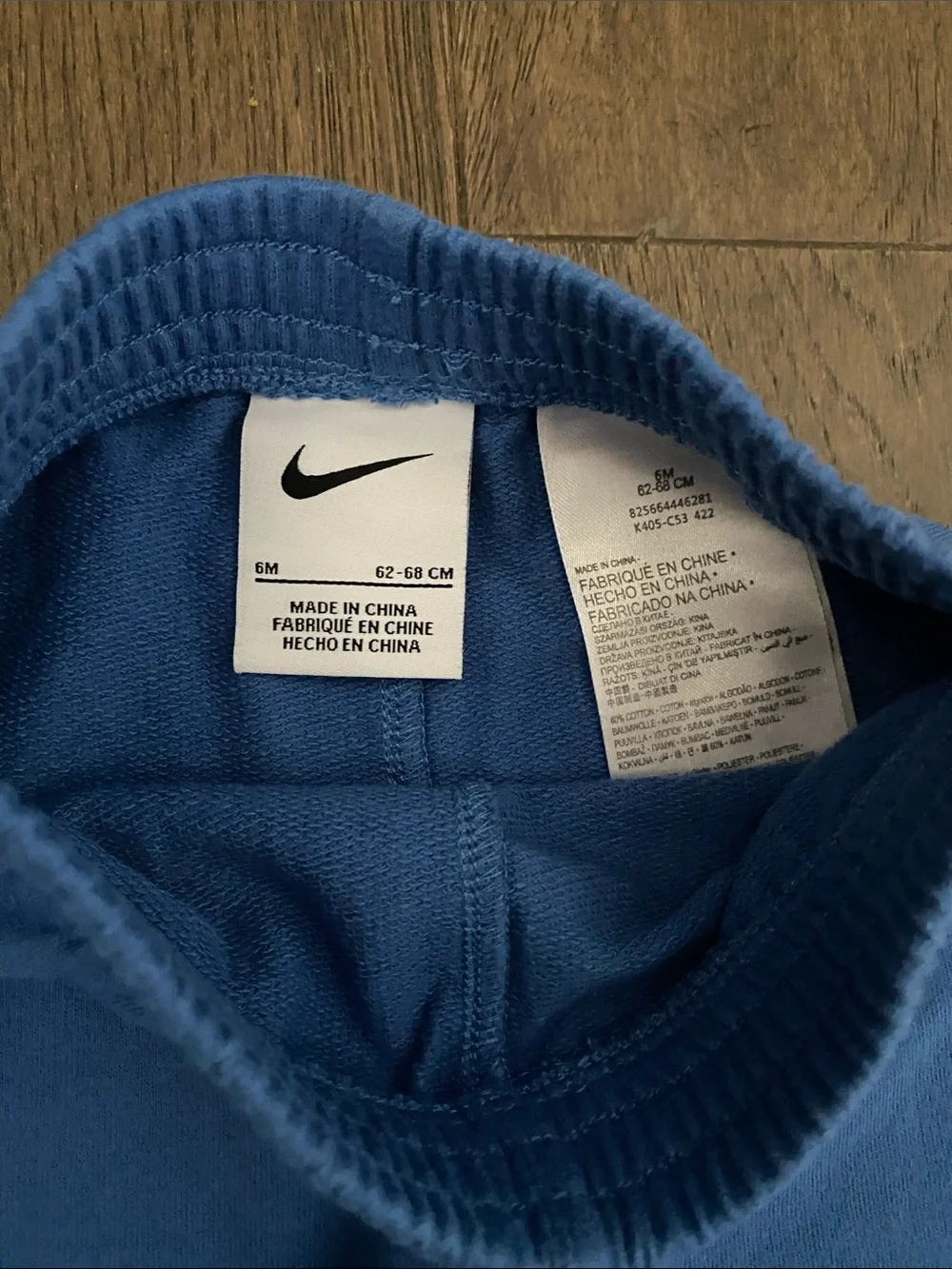 Nike White Bodysuit with Blue Joggers Baby Set